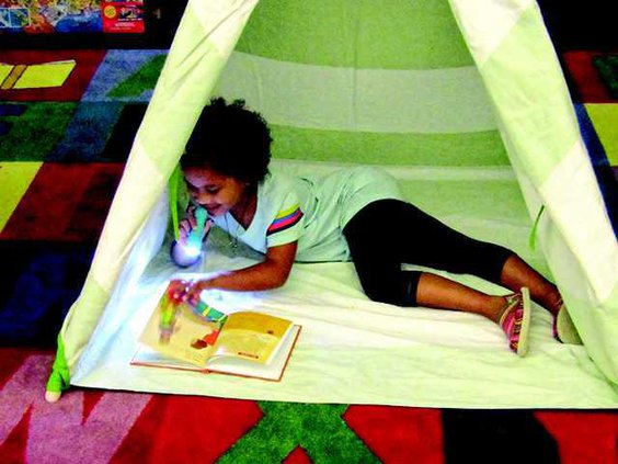 1 girl in tent reading